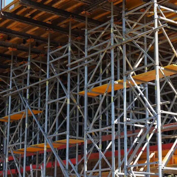 Heavy-duty scaffolding framework supporting a large construction structure in Stockton